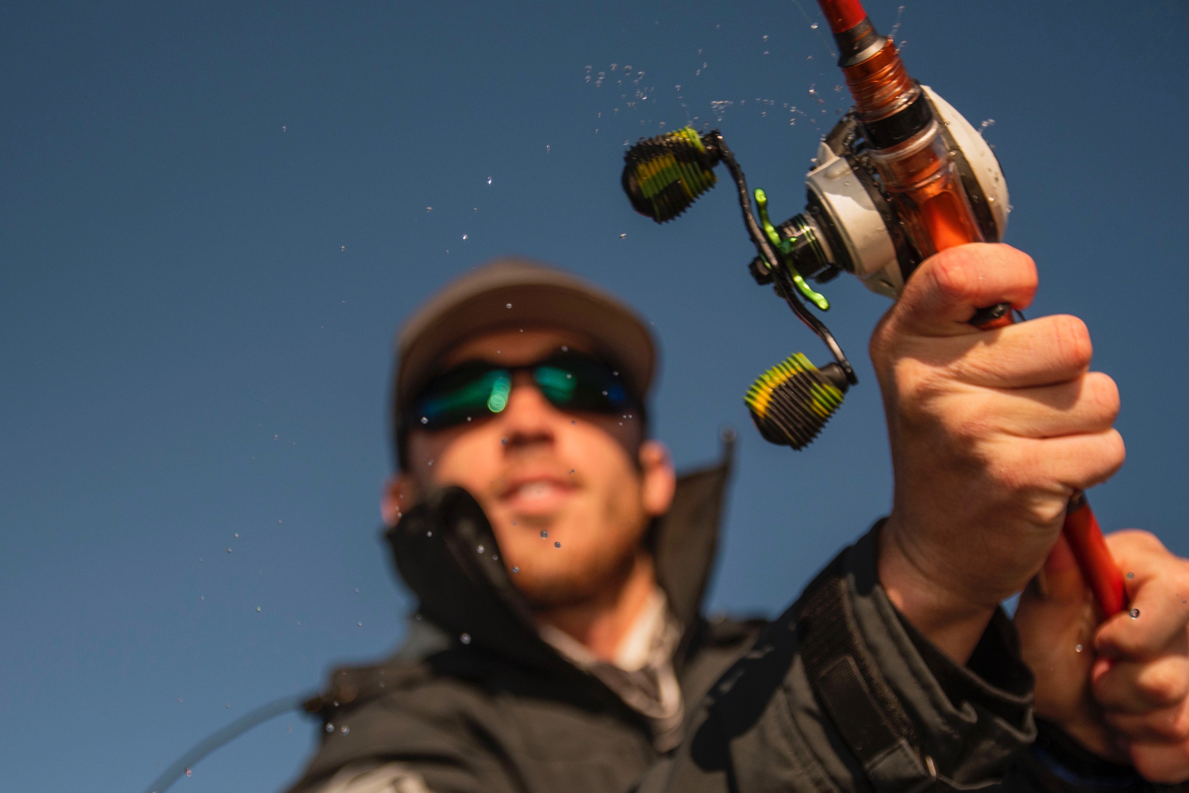 angler wearing green mirror sunglasses