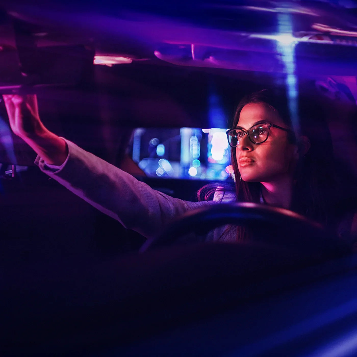woman driving with night driving glasses